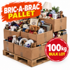 A bulk lot of assorted household goods packed into stacked cardboard boxes on a wooden pallet, with promotional text reading 'BRIC-A-BRAC PALLET' and '100kg BULK LOT'. The boxes contain mixed items including mugs, dishes, books, a teddy bear, a lamp, and framed pictures, all on a white background.